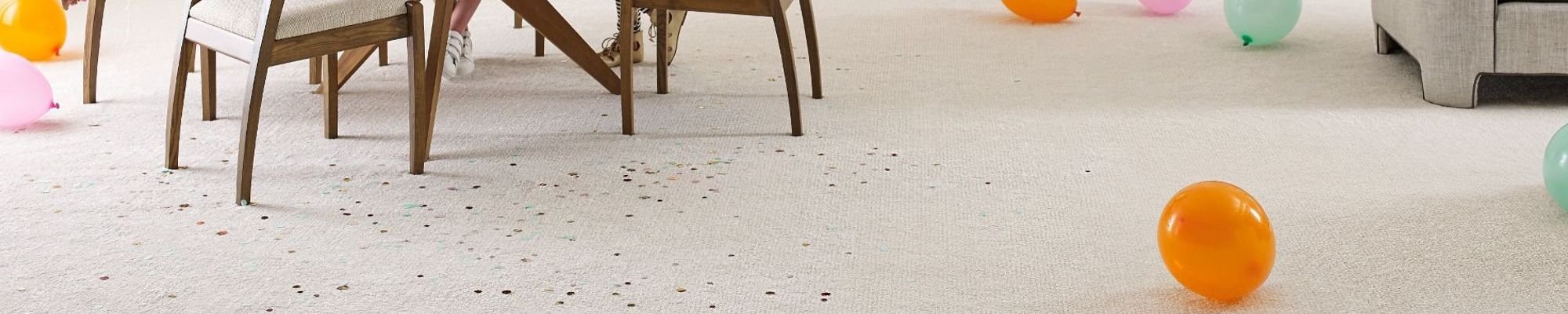 Living room with balloons on cream carpet from Flooring Source in the Auburn, MA area